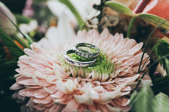 Engagement rings on top of a flower